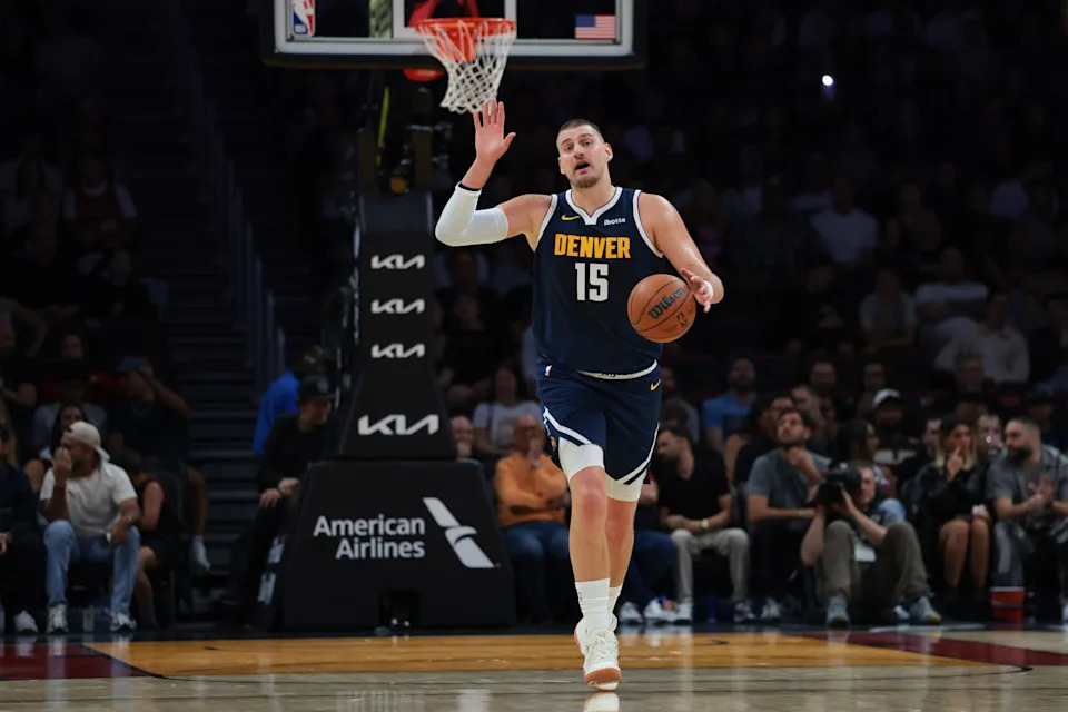Denver Nuggets center Nikola Jokic dribbles the basketball against the Miami Heat during the first quarter at Kaseya Center.
