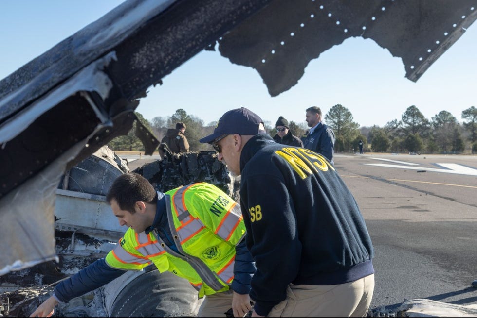 investigation scene at a crash site involving aviation safety officials