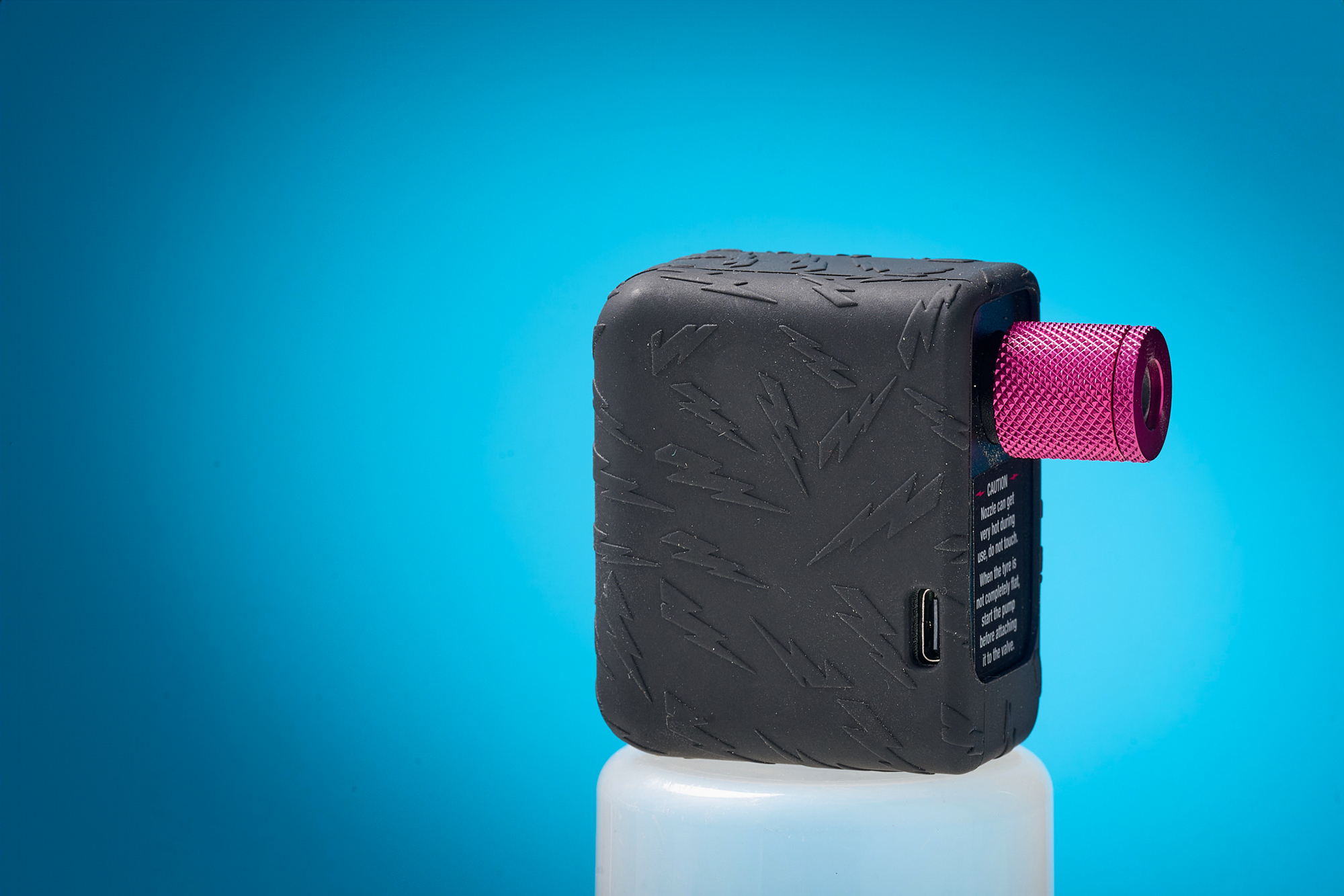 Muc-Off Airmach electric bike pump, with its distinctive pink nozzle.