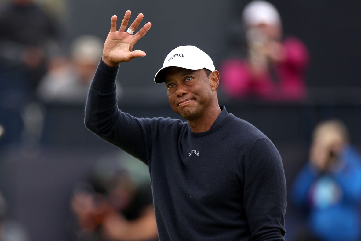 Woods acknowledges the crowd as he walks off the 18th green at the Open Championship in Troon, Scotland, in July 2024. <a href=