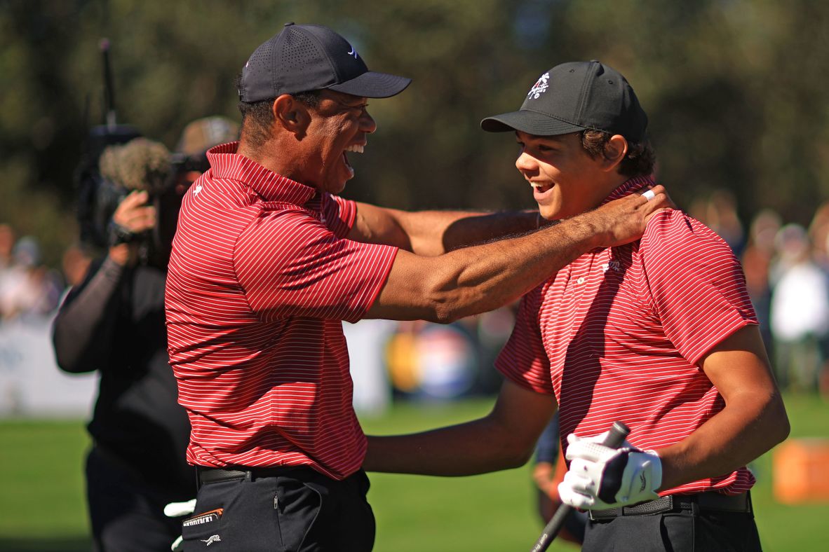 Woods and his son, Charlie, react at the PNC Championship after Charlie made a hole-in-one in December 2024. The father-son duo <a href=
