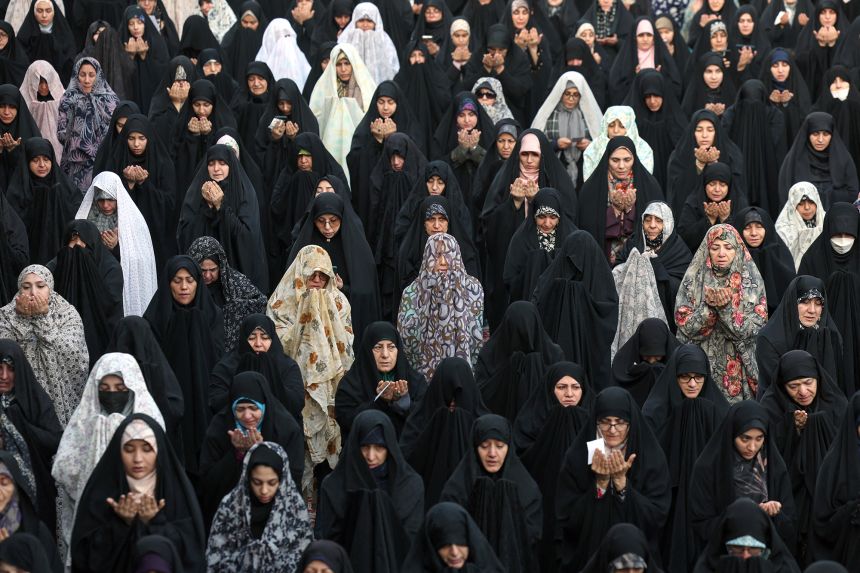Iranian women perform a prayer for rainfall at the Saleh Shrine in Tehran on November 14, 2025, as the country suffers from severe water shortages.