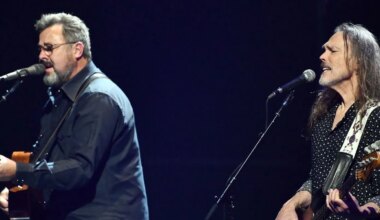 Vince Gill and Timothy B. Schmit performing with The Eagles