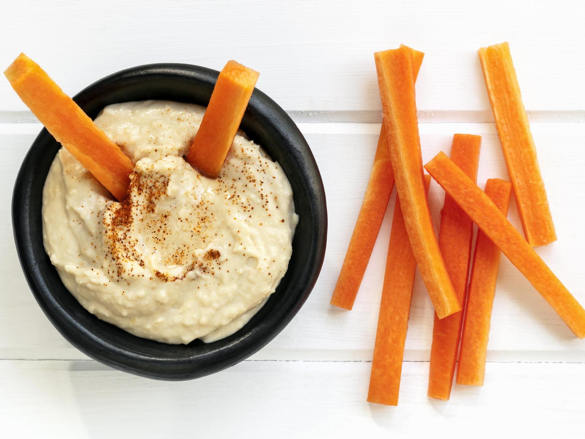 Dietitian Nichola Ludlam-Raine recommends aiming to include both fibre and protein in your snacks – for example, carrots and hummus