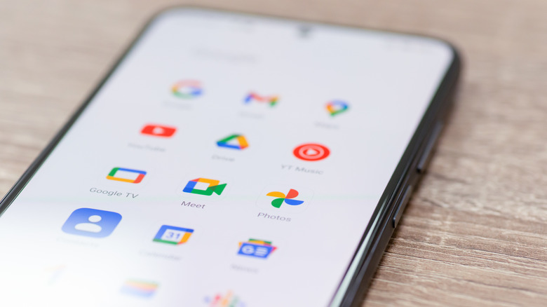 An Android phone displays several Google apps
