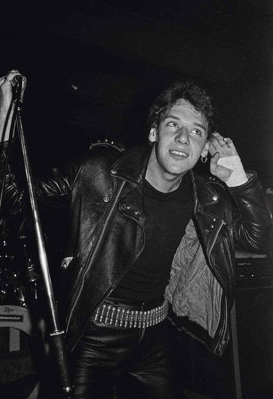 Paul Di'Anno onstage, cupping his ear