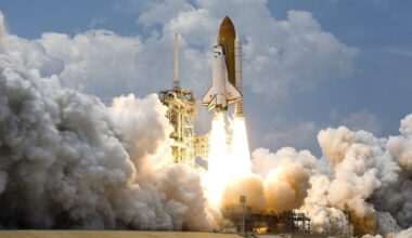 A white space shuttle launches off a pad with large clouds of smoke underneath it