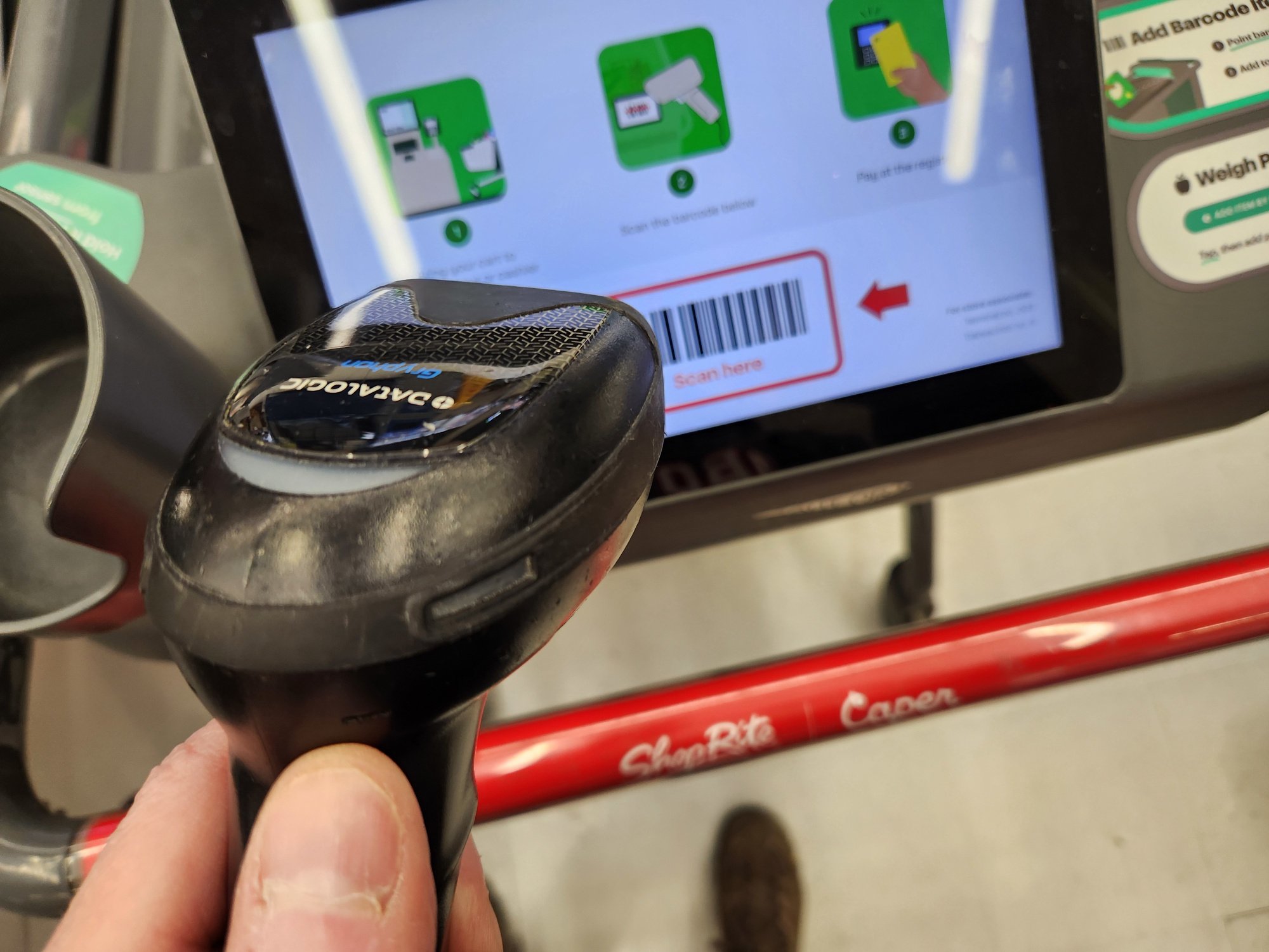 Scanning the checkout barcode on a Caper Cart
