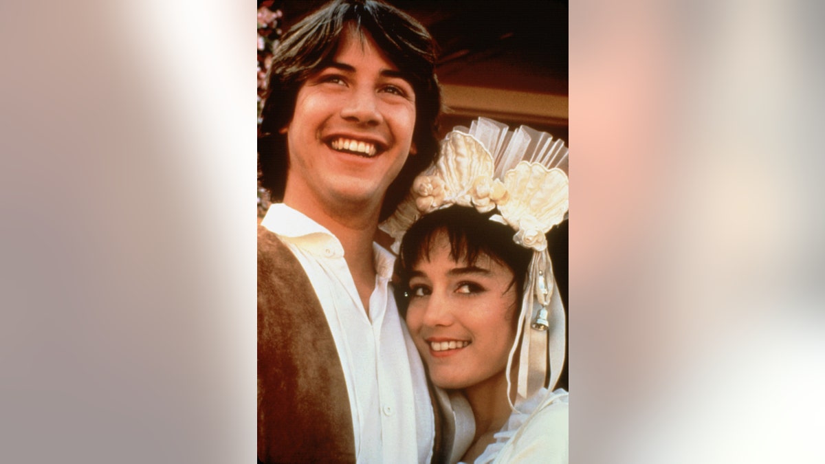 Jill Schoelen being embraced by Keanu Reeves.