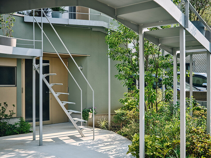looping terrace arcs toward the street to bring daylight inside a tokyo dwelling by HOAA