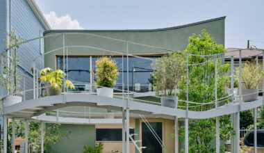 terrace arcs toward the street to bring light in tokyo home by HOAA