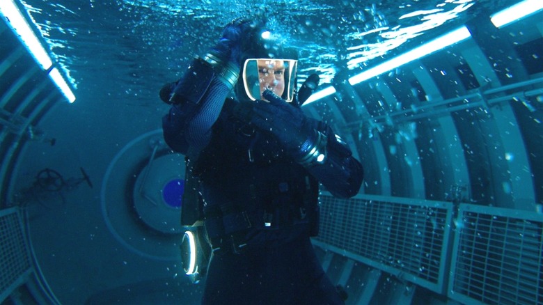 Ethan Hunt signals his allies before heading deeper into the ocean in Mission: Impossible - The Final Reckoning