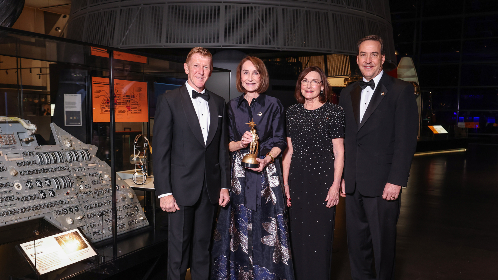 Time Peake with the Lovell family and their award