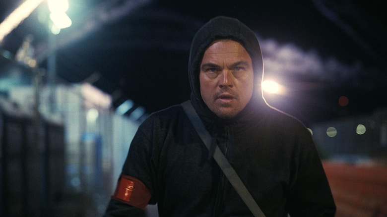 Leonardo DiCaprio as Bob Ferguson wearing a hoodie in One Battle After Another