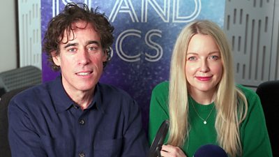 Stephen Merchant and Lauren Laverne sit in the Desert Island Discs studio.