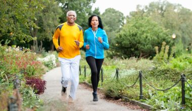 older couple run together in a park