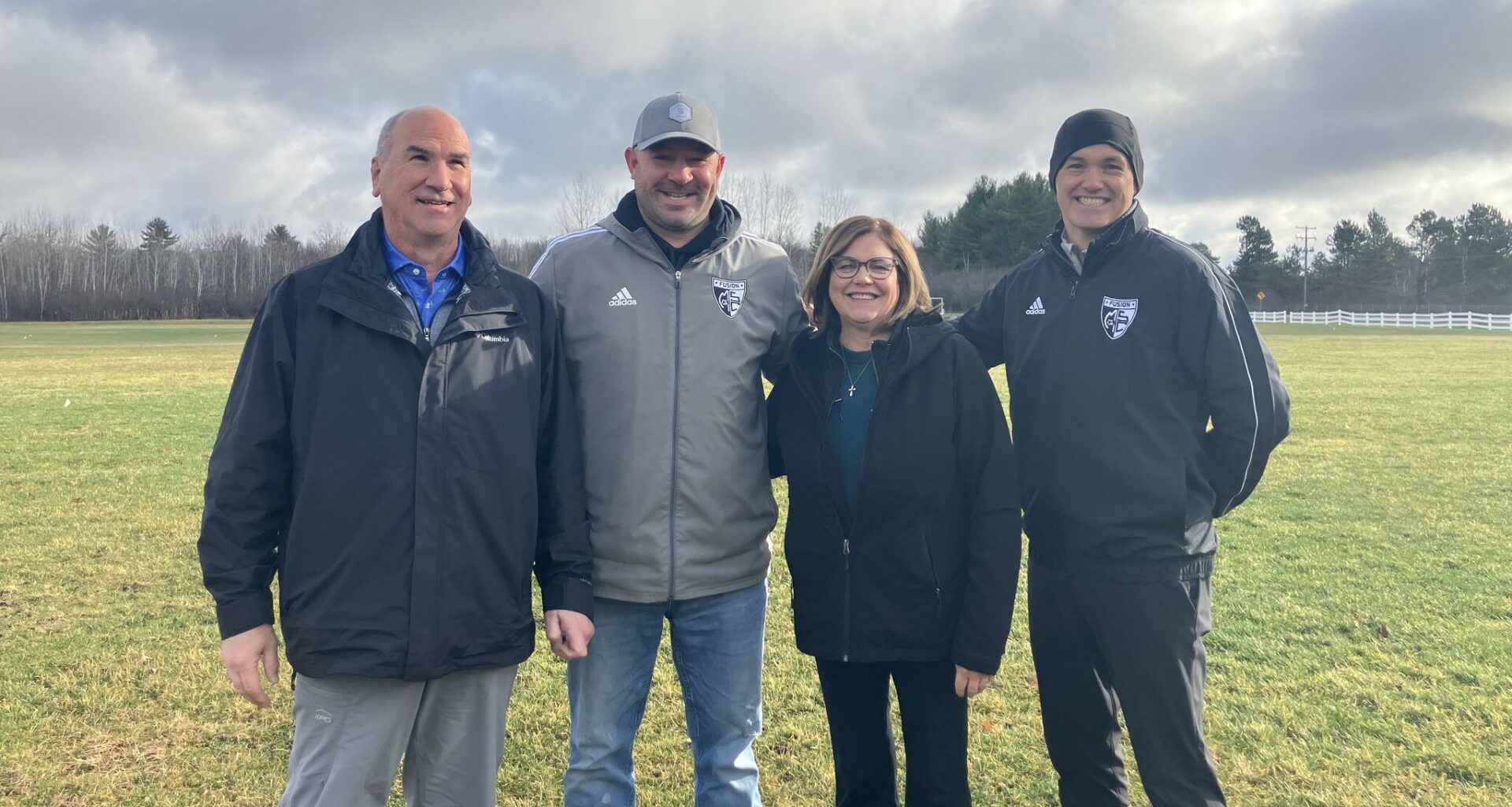 From left, Joe Kozuch, Marshall Gray, Ann Fillmore and Pete Corle stand on the future site of the Midland Soccer Club's 100,000-square-foot indoor training facility.