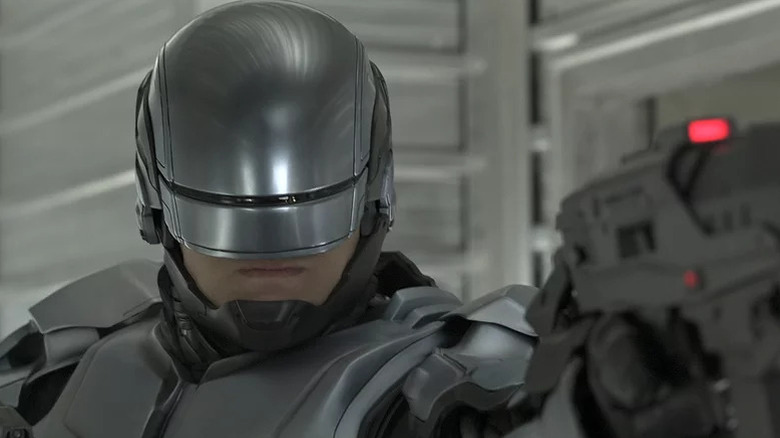 RoboCop aims a gun in RoboCop
