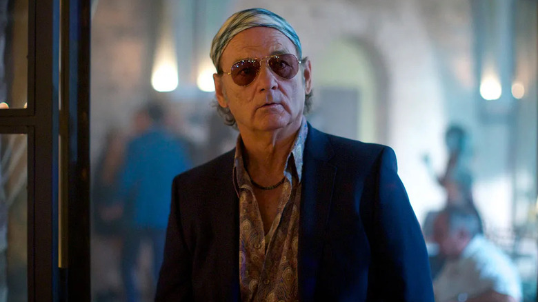 Bill Murray as Richie Lanz, eyes wide behind aviators in Rock the Kasbah