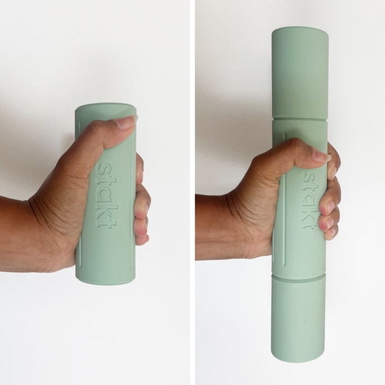 Someone holding a set of Stakt dumbbell weights