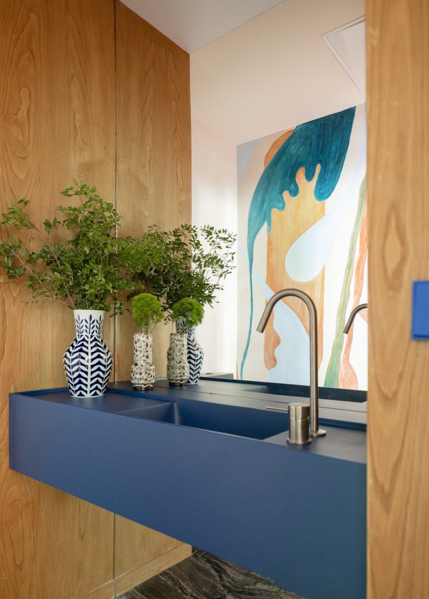 Bathroom with blue sink in office in Bilbao