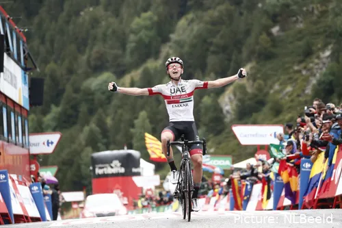 Tadej Pogacar raising his arms in celebration after winning stage 20 of the 2019 Vuelta a EspaƱa