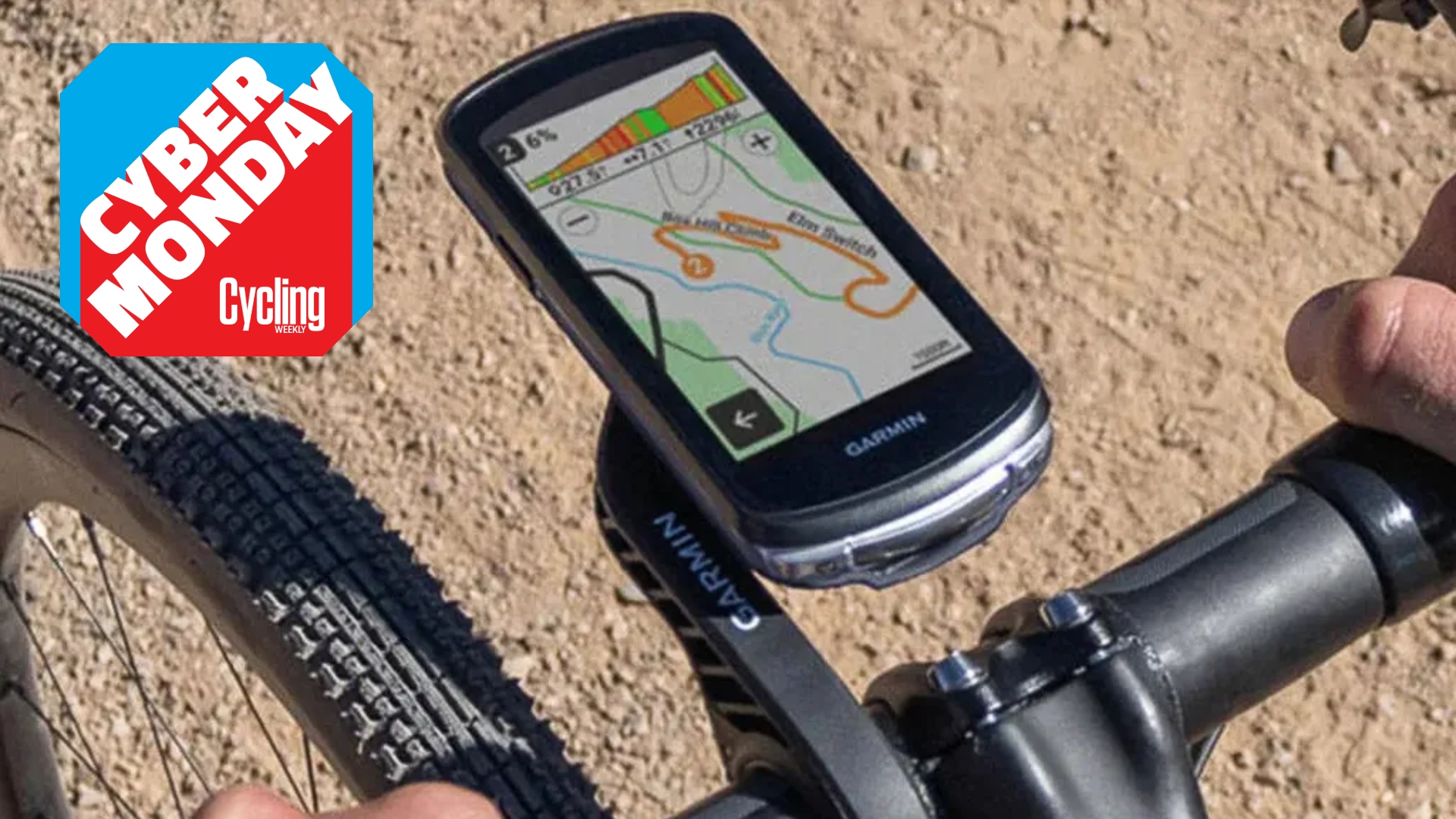 The Garmin Edge 1040 bike computer on gravel bike handle bars with a Cyber Monday roundal on the top left