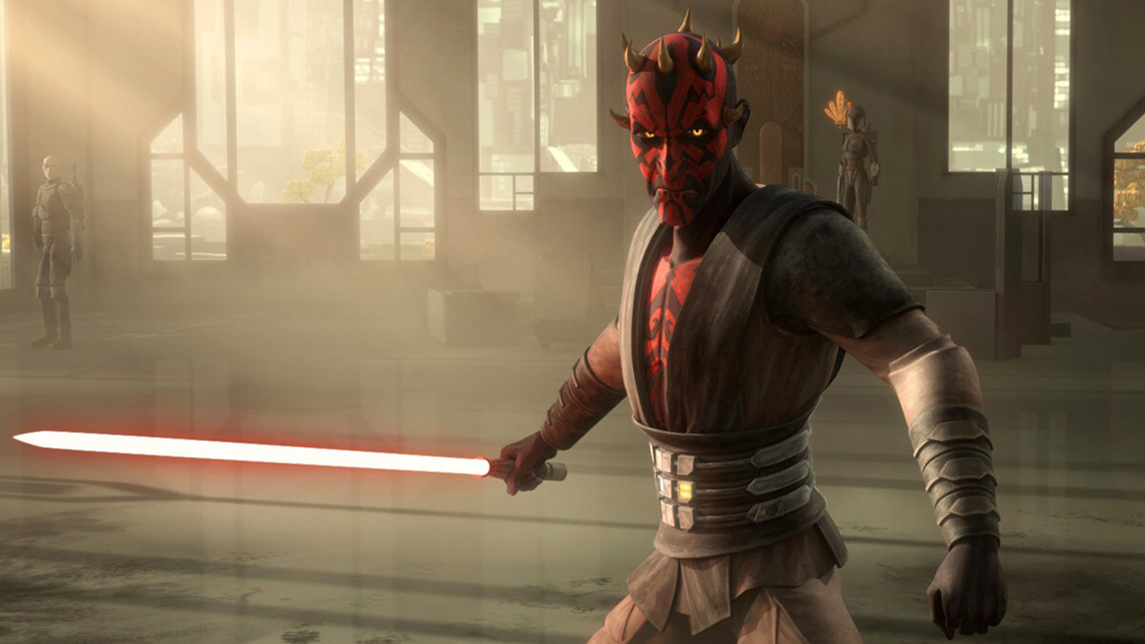 Still from a Star Wars TV cartoon. Darth Maul is ready to strike with his red lightsaber. He has black and red face markings and several small spiky horns around his head. His yellow eyes are glowing with anger.