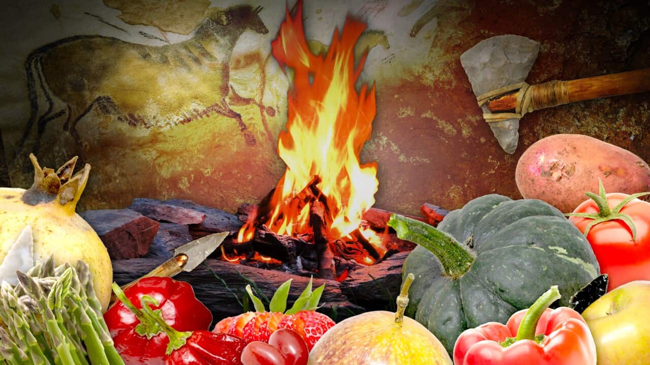 A cave painting with a fire and fruit and vegetables.