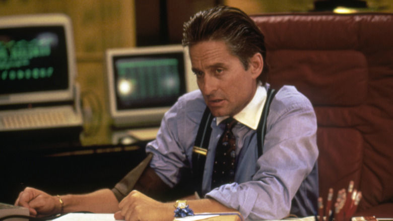 michael douglas at desk on set of wall street