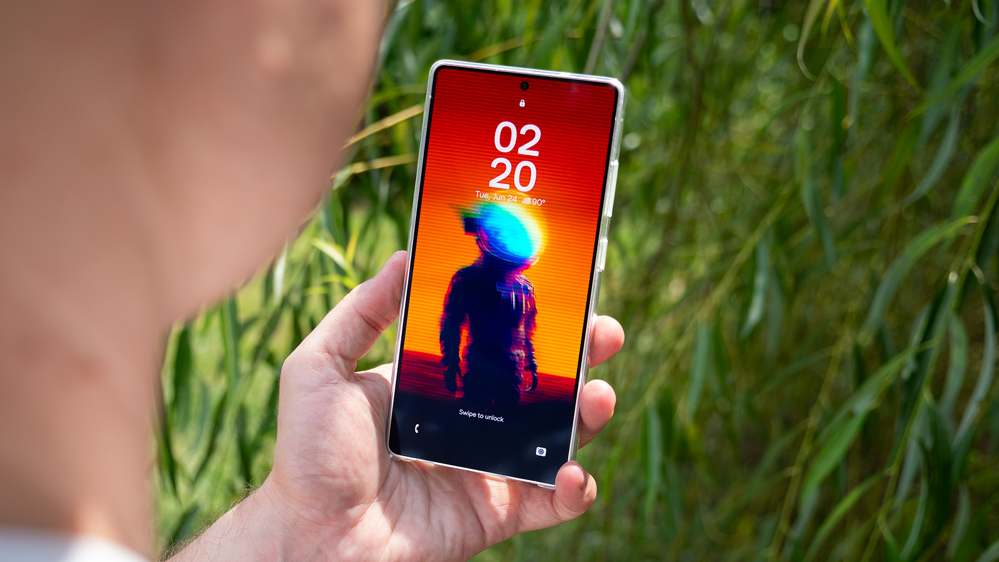 A vibrant astronaut wallpaper from the Backdrops app on the lockscreen of a Samsung Galaxy S25 Ultra