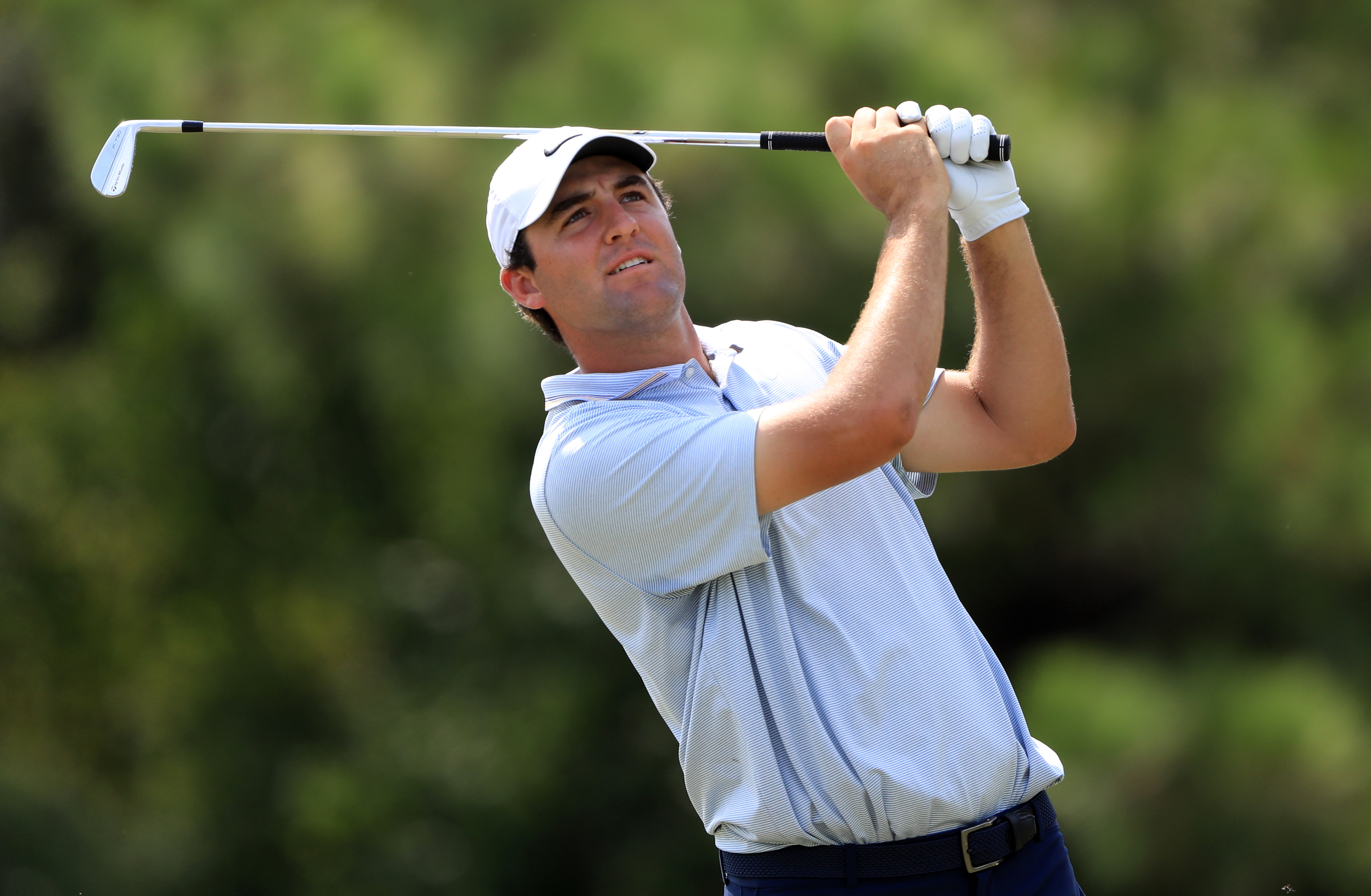 Scottie Scheffler hits an approach into the green