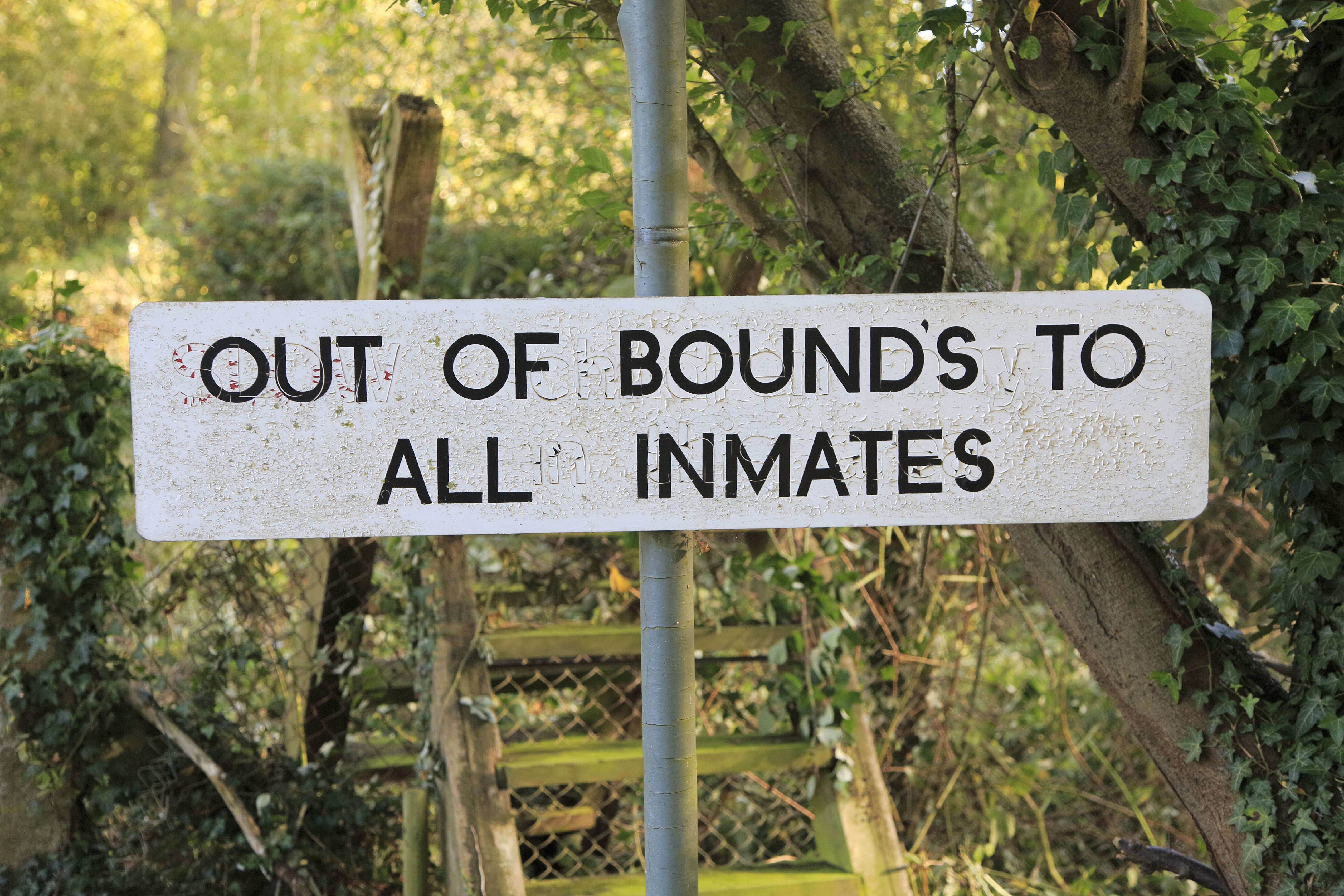 Sign reading "Out of Bounds to All Inmates" at HM Prison Hollesley Bay.