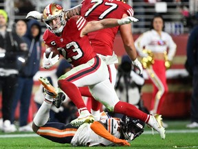 San Francisco 49ers running back Christian McCaffrey (23) runs against Chicago Bears safety C.J. Gardner-Johnson.