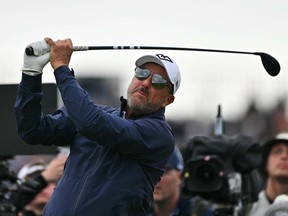 US golfer Phil Mickelson watches his shot from the 14th tee on the opening day of the 153rd Open Championship at Royal Portrush golf club in 2025.