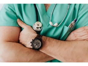 A physician crosses their arms.