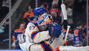 Connor McDavid shares a hug with Calvin Pickard