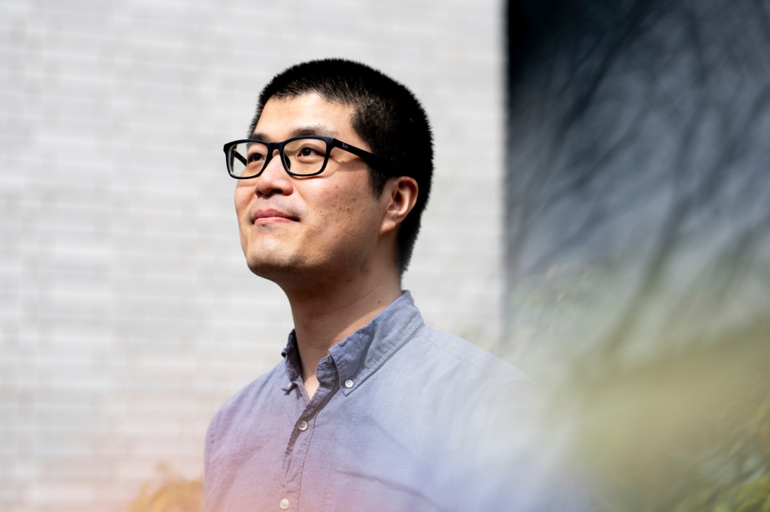 Professor Ruobing Bai poses for a portrait. 