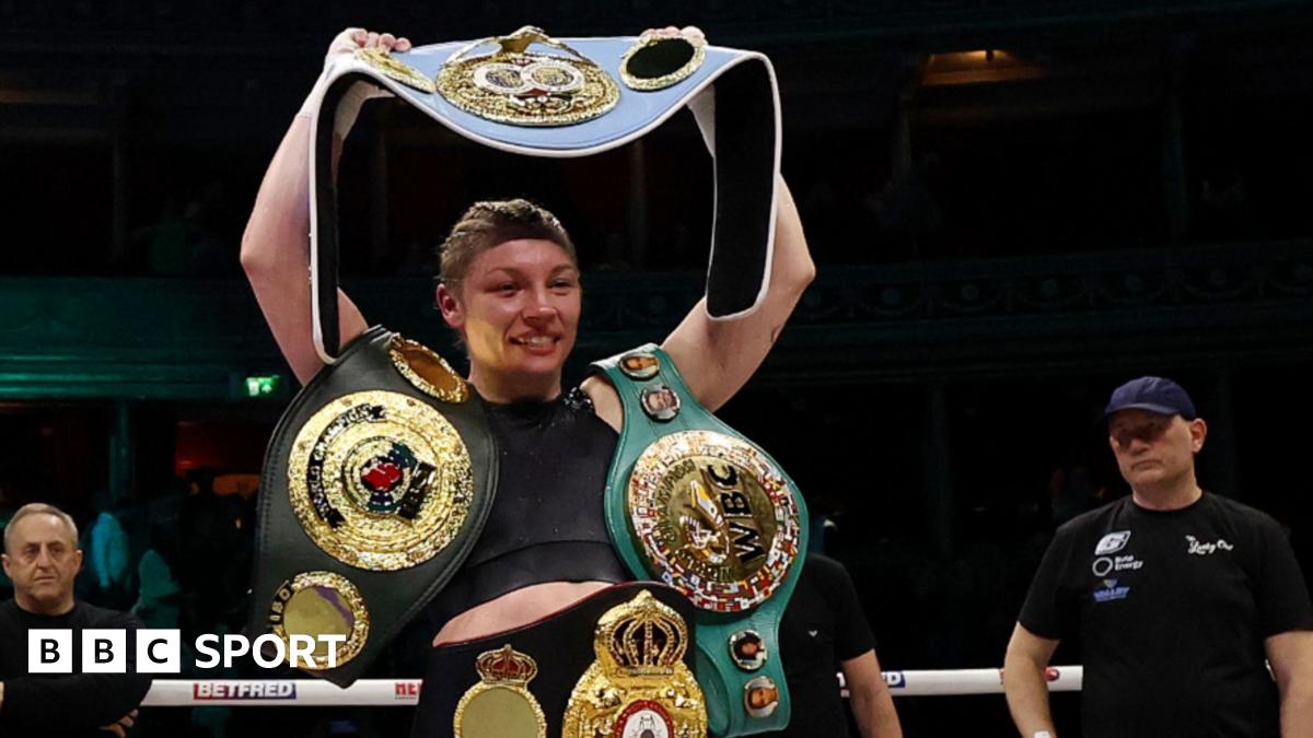 Lauren Price holds her world title belts in the ring