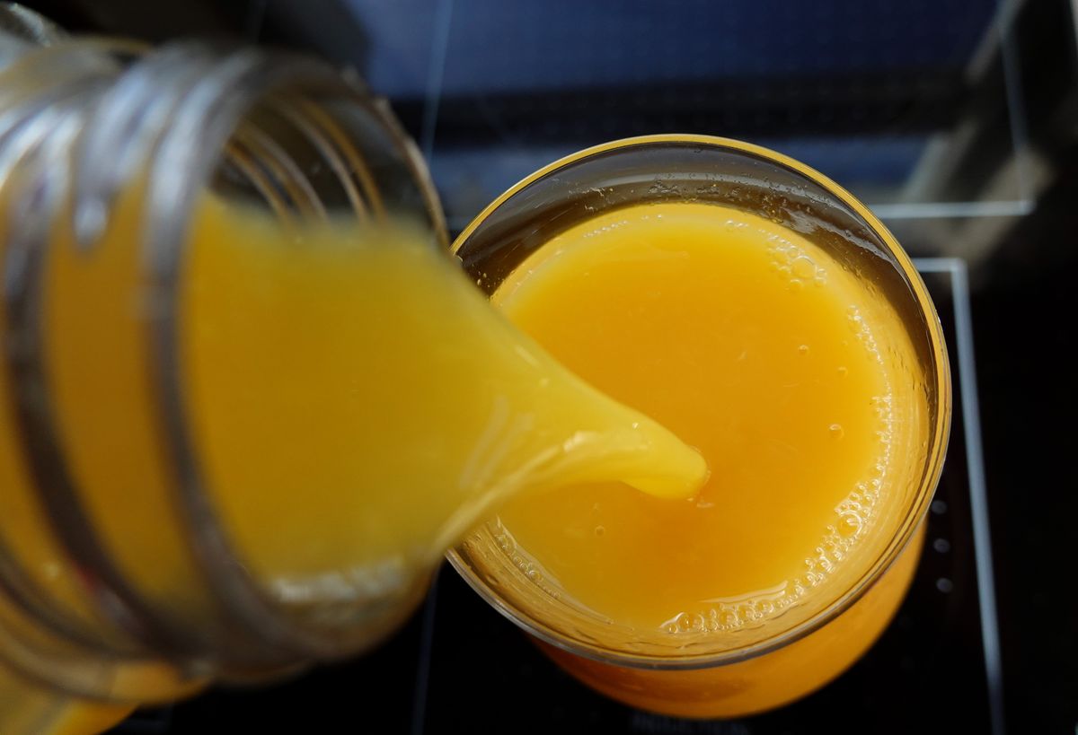 The honey and spices are added to an orange juice base