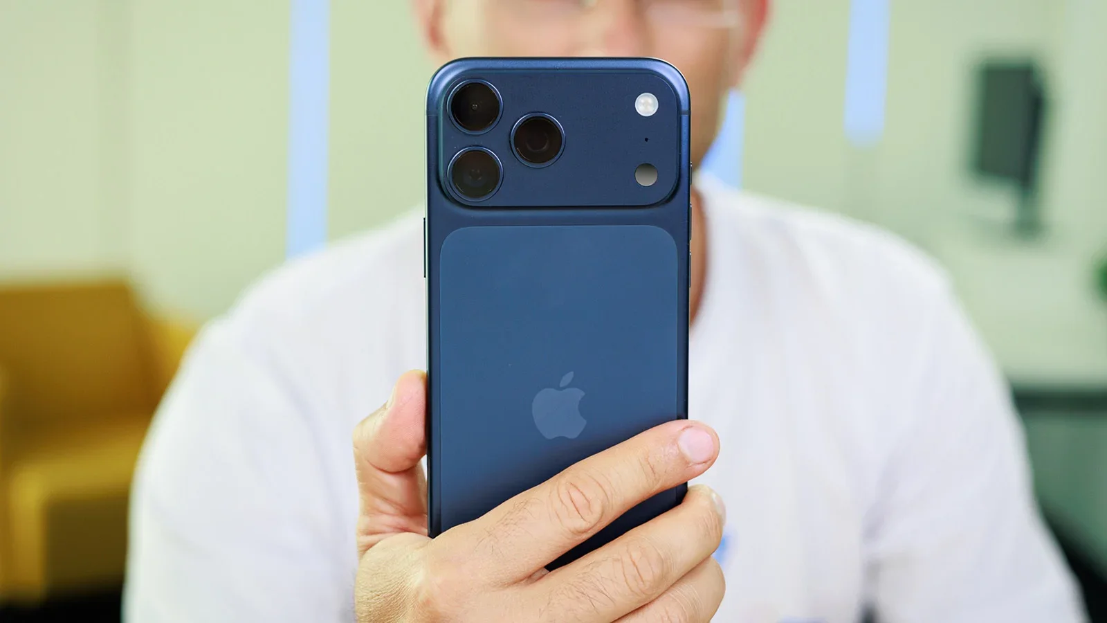 A man holding an iPhone.