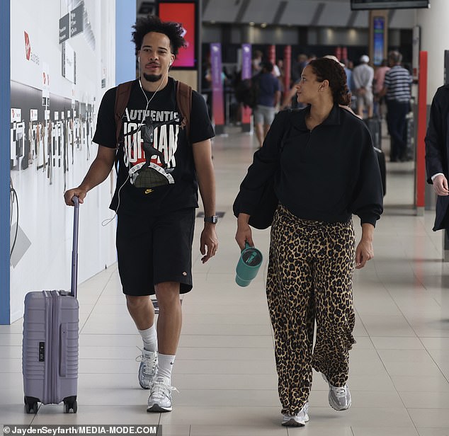 Marley cut a casual figure for the flight, stepping out in a black Nike Air Jordan T-shirt. The basketballer also wore a pair of plain black Dickies shorts and finished his look with a pair of white Nike sneakers
