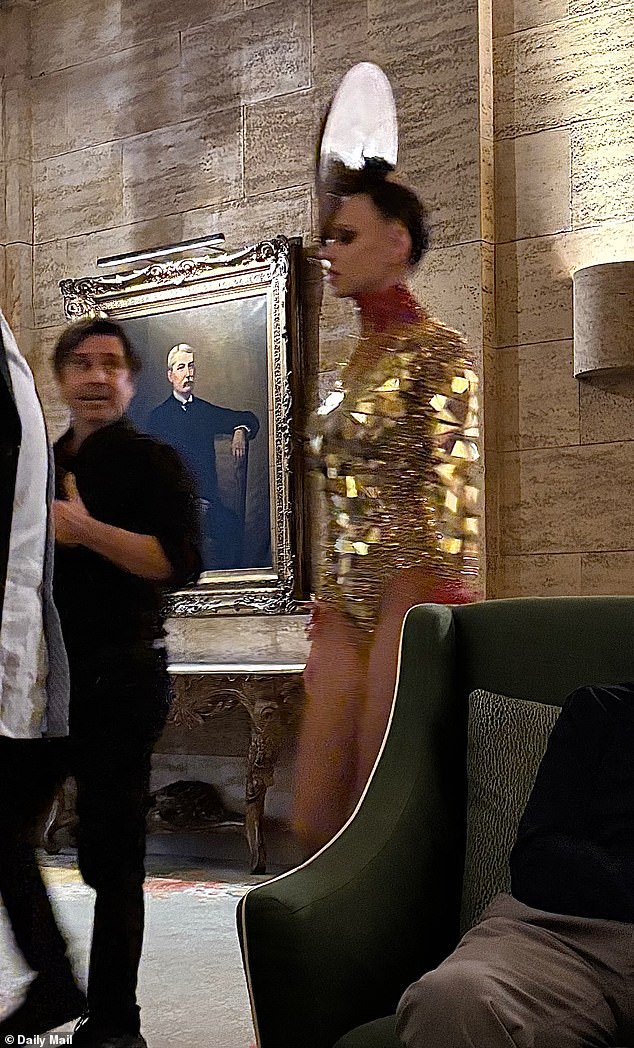 A showgirl walks through the Breakers in Palm Beach, Florida during Woods' 50th birthday