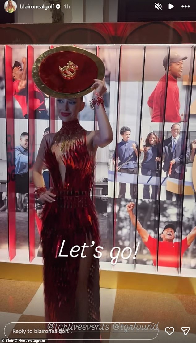 One guest shows off her red dress to go with the theme of the evening in Palm Beach