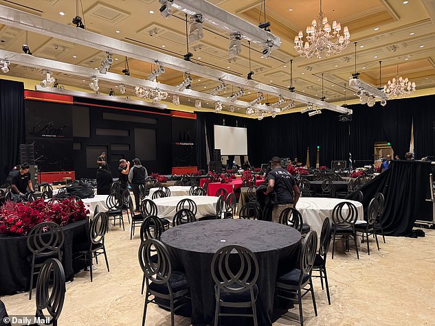 The Breakers ballroom is seen after the party as crew work to take down the scenery