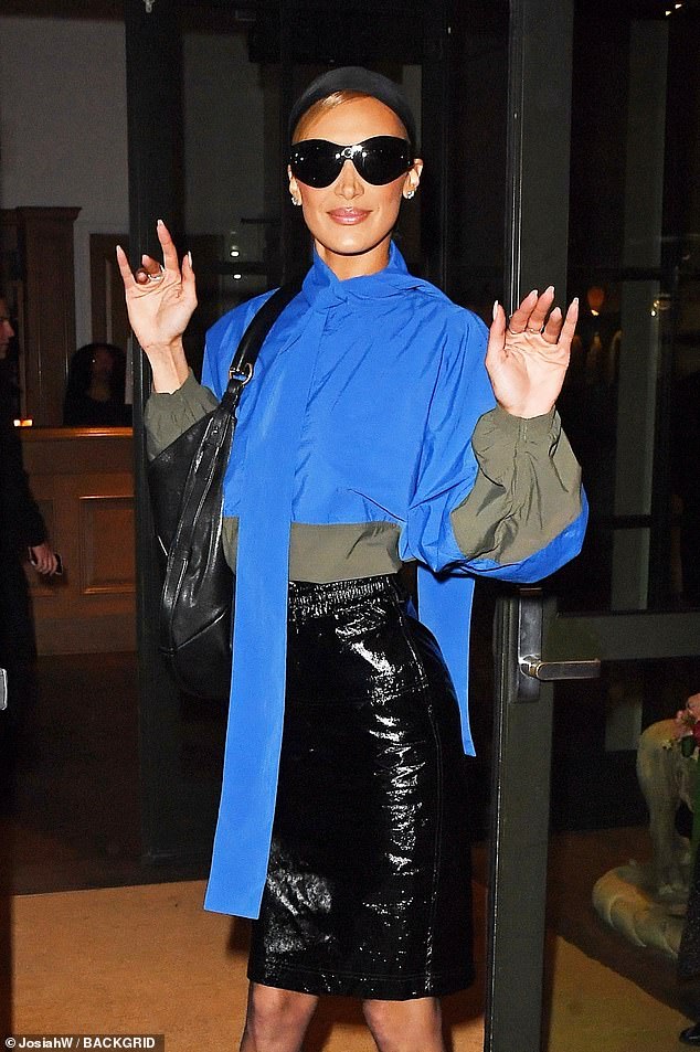 She had a scarf over her blonde hair and sunglasses over her eyes