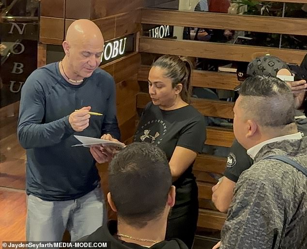 Agassi was happy to chat with fans, sign autographs and pose for photos after his dinner