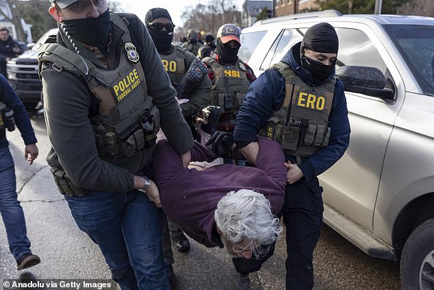 Federal Agents arrest a man during an Immigration Enforcement Operation in Minneapolis