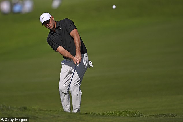 Koepka plays a shot on the tenth hole during the first round of the Farmers Insurance Open