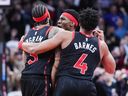 Brandon Ingram of the Toronto Raptors celebrates his game-winning shot with Scottie Barnes and Ja'Kobe Walter against the Indiana Pacers.